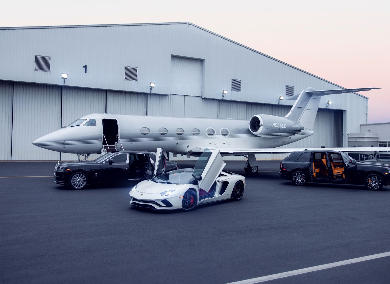 a rolls royce parked in front of a craft jet